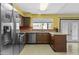 Bright kitchen featuring granite countertops, stainless steel appliances, and a window over the sink at 17244 N 29Th Ave, Phoenix, AZ 85053