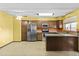 Open kitchen with stainless steel appliances, granite countertops, tiled floor and plenty of space at 17244 N 29Th Ave, Phoenix, AZ 85053