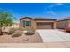 Charming single-story home with low maintenance landscaping and a two-car garage at 1762 E Elegante Dr, Casa Grande, AZ 85122