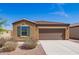 Charming single-story home with low maintenance landscaping and a two-car garage at 1762 E Elegante Dr, Casa Grande, AZ 85122