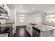 Spacious kitchen features granite countertops, stainless steel appliances, and a view of the living room at 1762 E Elegante Dr, Casa Grande, AZ 85122