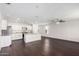Bright modern kitchen and living area features hardwood floors and stainless appliances at 1762 E Elegante Dr, Casa Grande, AZ 85122
