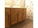 Bathroom featuring a vanity with wood-look cabinet and silver handles at 1827 E Carla Vista Dr, Gilbert, AZ 85295