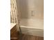 White bathtub with shower and patterned shower curtain at 1827 E Carla Vista Dr, Gilbert, AZ 85295