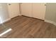 Cozy bedroom corner with closet doors and wood-look flooring for a clean and modern touch at 1827 E Carla Vista Dr, Gilbert, AZ 85295