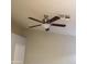 Ceiling fan with dark brown blades and a light fixture at 1827 E Carla Vista Dr, Gilbert, AZ 85295