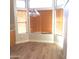 Bright dining area with wood-look floor and many windows at 1827 E Carla Vista Dr, Gilbert, AZ 85295
