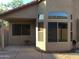 Exterior of the property featuring windows and a covered patio at 1827 E Carla Vista Dr, Gilbert, AZ 85295
