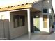 The exterior of the home features a covered patio and plentiful windows at 1827 E Carla Vista Dr, Gilbert, AZ 85295