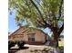 Charming home featuring desert landscaping, a tile roof, and mature trees providing shade at 1827 E Carla Vista Dr, Gilbert, AZ 85295