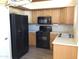 Updated kitchen with stainless steel sink and black appliances at 1827 E Carla Vista Dr, Gilbert, AZ 85295