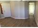 Bright living room showcasing new flooring and fresh paint, leading to other areas of the home at 1827 E Carla Vista Dr, Gilbert, AZ 85295