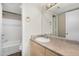 Bathroom featuring a vanity, mirror, and shower/tub combo at 1880 E Morten Ave # 125, Phoenix, AZ 85020