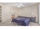 Serene bedroom with neutral tones, a ceiling fan, and an ensuite bathroom at 1880 E Morten Ave # 125, Phoenix, AZ 85020