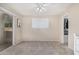 Cozy bedroom features plush carpeting, a sliding glass door, and an ensuite closet at 1880 E Morten Ave # 125, Phoenix, AZ 85020