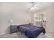 Relaxing bedroom featuring a ceiling fan, sliding glass doors, and a calming atmosphere at 1880 E Morten Ave # 125, Phoenix, AZ 85020