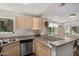 Bright and functional kitchen offering stainless steel appliances and bar seating at 1880 E Morten Ave # 125, Phoenix, AZ 85020