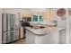 Well-lit kitchen featuring stainless steel appliances and plenty of counter space at 1880 E Morten Ave # 125, Phoenix, AZ 85020