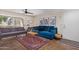 Bright living room featuring two couches, stylish decor, and access to a patio at 1880 E Morten Ave # 125, Phoenix, AZ 85020