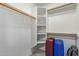 Bright walk-in closet with ample shelving and storage space with carpeted floor at 1880 E Morten Ave # 125, Phoenix, AZ 85020