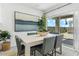Contemporary dining area with large window and sliding door access to the outdoor area at 18812 E Bruno Dr, Gold Canyon, AZ 85118