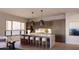 Modern kitchen featuring a marble island and designer pendant lighting at 19360 N 73Rd St # 1070, Scottsdale, AZ 85255