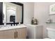 Bathroom featuring a modern vanity, toilet, and decorative elements at 20366 E Via De Colina --, Queen Creek, AZ 85142