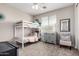 bedroom featuring bunkbeds, comfortable chair, modern light fixture, and ceiling fan at 20366 E Via De Colina --, Queen Creek, AZ 85142