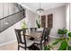 Elegant dining room with chandelier, table, and decorative wine rack, ideal for gatherings and entertaining at 20366 E Via De Colina --, Queen Creek, AZ 85142