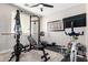 This exercise room features carpet flooring, a ceiling fan and plenty of work-out equipment at 20366 E Via De Colina --, Queen Creek, AZ 85142
