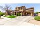 Stunning two-story home with covered parking, lush landscaping, and classic car at 20366 E Via De Colina --, Queen Creek, AZ 85142