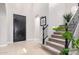 Entryway featuring a staircase, elegant door, and tasteful decor, creating a welcoming first impression at 20366 E Via De Colina --, Queen Creek, AZ 85142