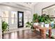 Bright foyer with hardwood floors and stylish plants, creating a warm and inviting entry at 20366 E Via De Colina --, Queen Creek, AZ 85142