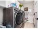 Convenient laundry room featuring modern LG washer and dryer set and white cabinets for storing supplies at 20366 E Via De Colina --, Queen Creek, AZ 85142