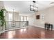 Open living area featuring wood floors and a staircase with decorative railing at 20366 E Via De Colina --, Queen Creek, AZ 85142