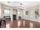 Spacious living room with wood floors, ample windows, and stylish decor at 20366 E Via De Colina --, Queen Creek, AZ 85142