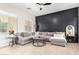 Spacious living room with a ceiling fan, modern decor, and a comfortable sectional sofa at 20366 E Via De Colina --, Queen Creek, AZ 85142