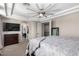 Spacious main bedroom featuring a tray ceiling, ceiling fan, carpet, and access to the main bathroom at 20366 E Via De Colina --, Queen Creek, AZ 85142