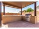 Outdoor kitchen complete with grill, counter space and perfect for outdoor entertaining in style at 20366 E Via De Colina --, Queen Creek, AZ 85142