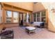 Cozy outdoor patio with stylish seating, a fire pit, and ample sunlight at 20366 E Via De Colina --, Queen Creek, AZ 85142