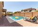 Beautiful backyard featuring a sparkling pool, a built-in BBQ, and a covered patio at 20366 E Via De Colina --, Queen Creek, AZ 85142