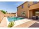 Beautiful backyard oasis with a sparkling pool, inviting lounge chairs and a lush green backdrop at 20366 E Via De Colina --, Queen Creek, AZ 85142