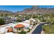 Stunning aerial view of a desert community with terracotta rooftops nestled against a mountain backdrop at 2132 E Northview Ave, Phoenix, AZ 85020