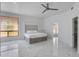 Bright, spacious bedroom with neutral tones, marble flooring, and a contemporary platform bed at 2132 E Northview Ave, Phoenix, AZ 85020