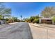 Community entrance to Villas Encantadas, featuring lush landscaping and a welcoming, private street at 2132 E Northview Ave, Phoenix, AZ 85020