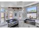 Bright kitchen featuring a stainless steel sink, marble counters, backsplash, and modern appliances at 2132 E Northview Ave, Phoenix, AZ 85020