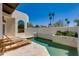 Inviting private pool with travertine tile and lounge chairs surrounded by lush greenery at 2132 E Northview Ave, Phoenix, AZ 85020