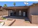 Covered back patio includes a ceiling fan, brick accents, and an outdoor area at 2179 E Palmcroft Dr, Tempe, AZ 85282