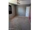Bedroom with carpeted floors, ceiling fan, and decorative wall text at 2179 E Palmcroft Dr, Tempe, AZ 85282