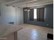 Dining room with tiled floors, chandelier, and gray accent wall at 2179 E Palmcroft Dr, Tempe, AZ 85282